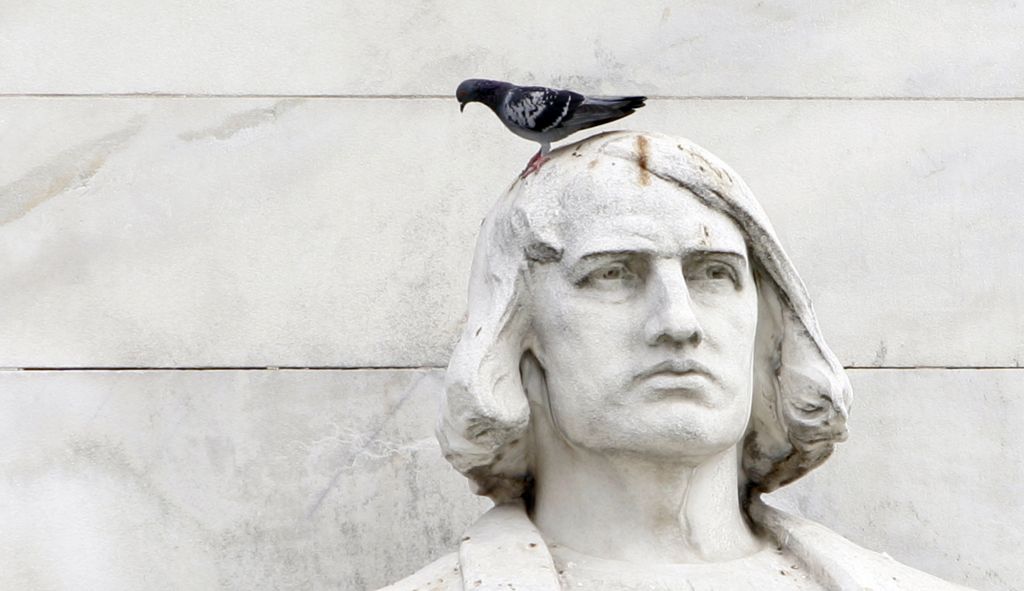 A pigeon sits on a statue of Christopher Columbus during a civic ceremony honoring Columbus outside Union Station in Washington, Monday, Oct. 8, 2007. (AP Photos/Susan Walsh) ORG XMIT: DCSW105